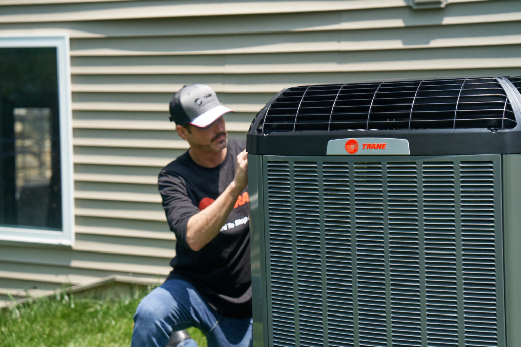 Trane Employee Working on unit outdoors